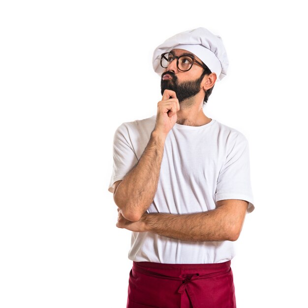 Chef thinking over white background