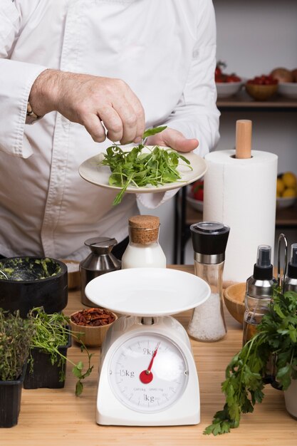 Chef weighing ingredients