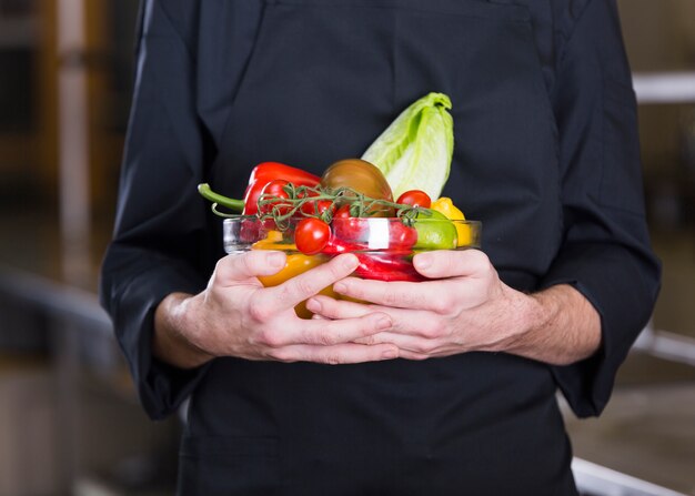 Chef with fruits and vegetables