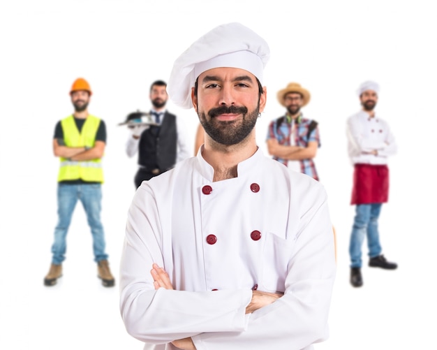 Chef with his arms crossed over white background