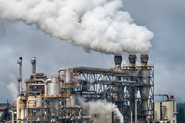 chemical-factory-with-smoke-stack-smoke-emission-from-factory-pipes_99272-622.jpg