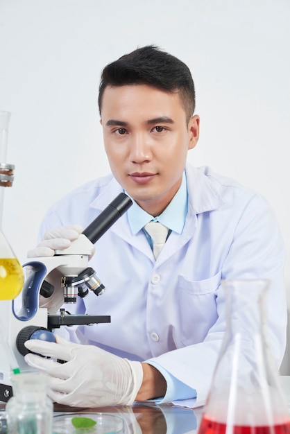 Chemist working with miscroscope