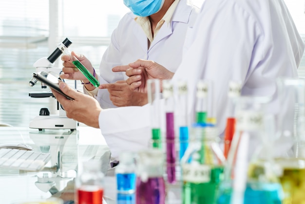 Chemists Carrying out Experiment