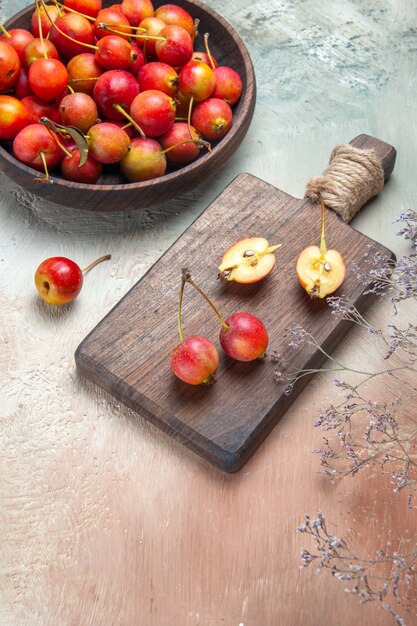 cherries berries on the board bowl of cherries tree branches