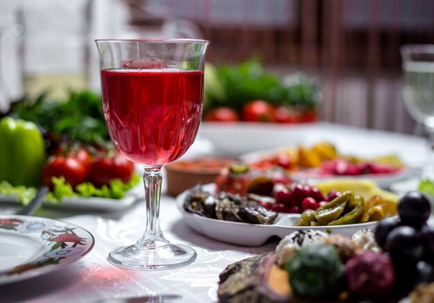 Cherry compote in the glass on the table side view