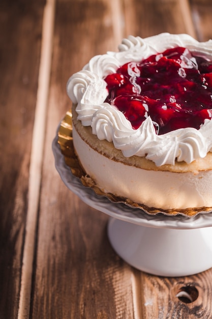 Cherry jam cake on wooden table