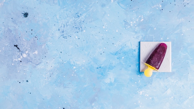 Free Photo cherry popsicle on napkin