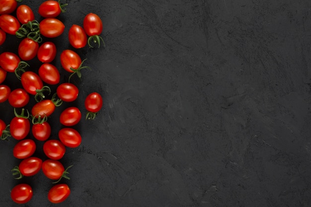 Cherry tomatoes red ripe fresh on grey background