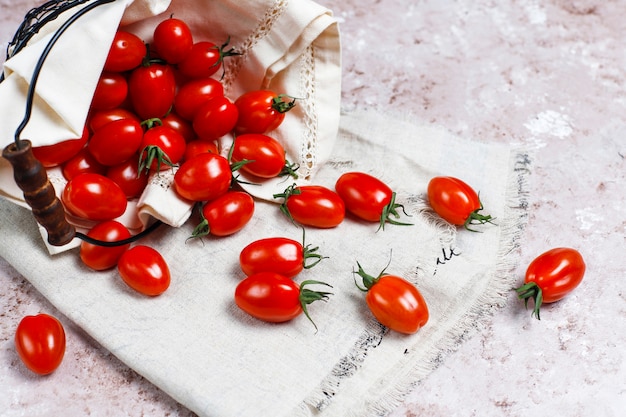 Cherry tomatoes of various colors,yellow and red cherry tomatoes on light background