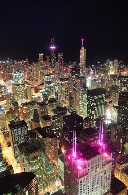 Chicago downtown aerial view at night with skyscrapers and city skyline at Michigan lakefront.