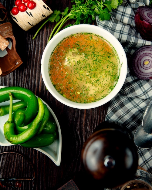 Free photo chicken broth vegetable soup with herbs