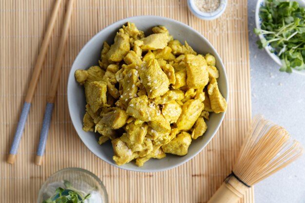 Chicken in curry sauce served in bowl