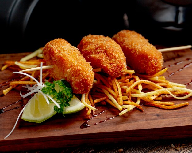 Chicken cutlets served with french fries