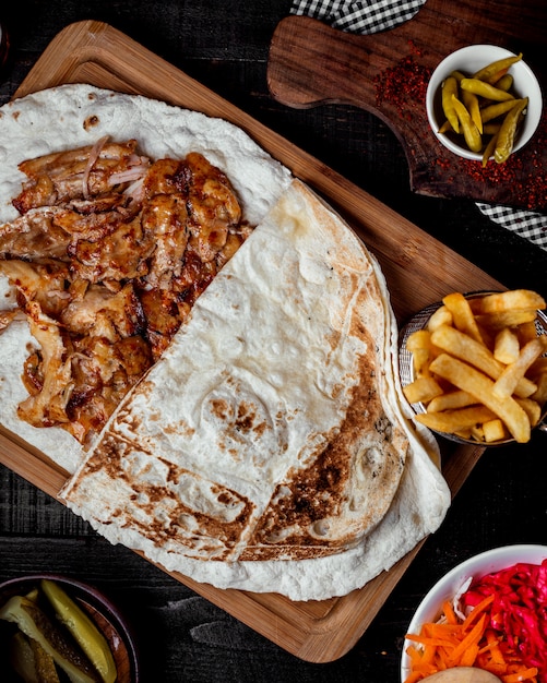 Chicken doner kebab placed on flatbread