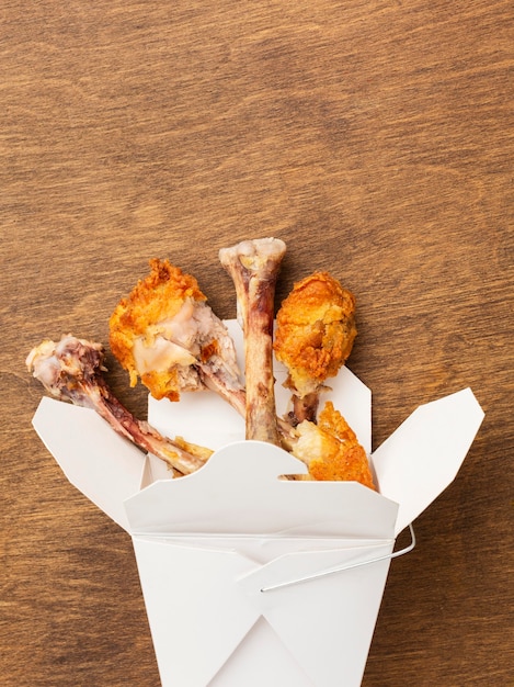 Free photo chicken drumsticks leftover food waste