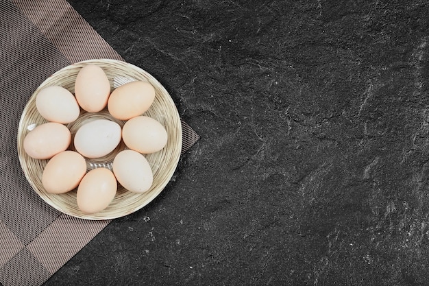 Chicken Eggs On Ceramic Plate. View From Above.