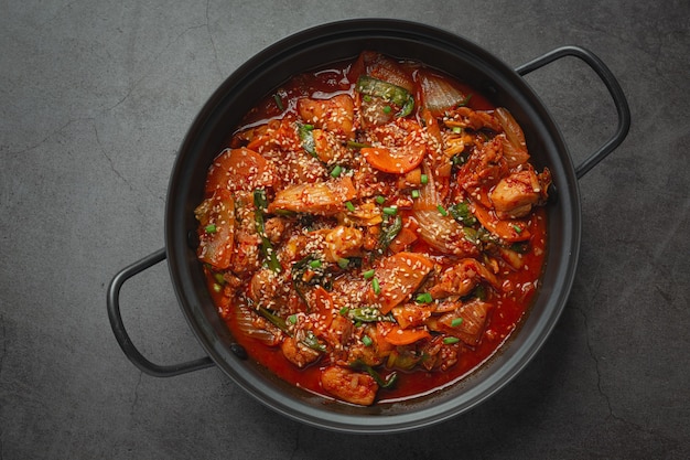 Chicken fried in hot pot with spicy sauce in korean style