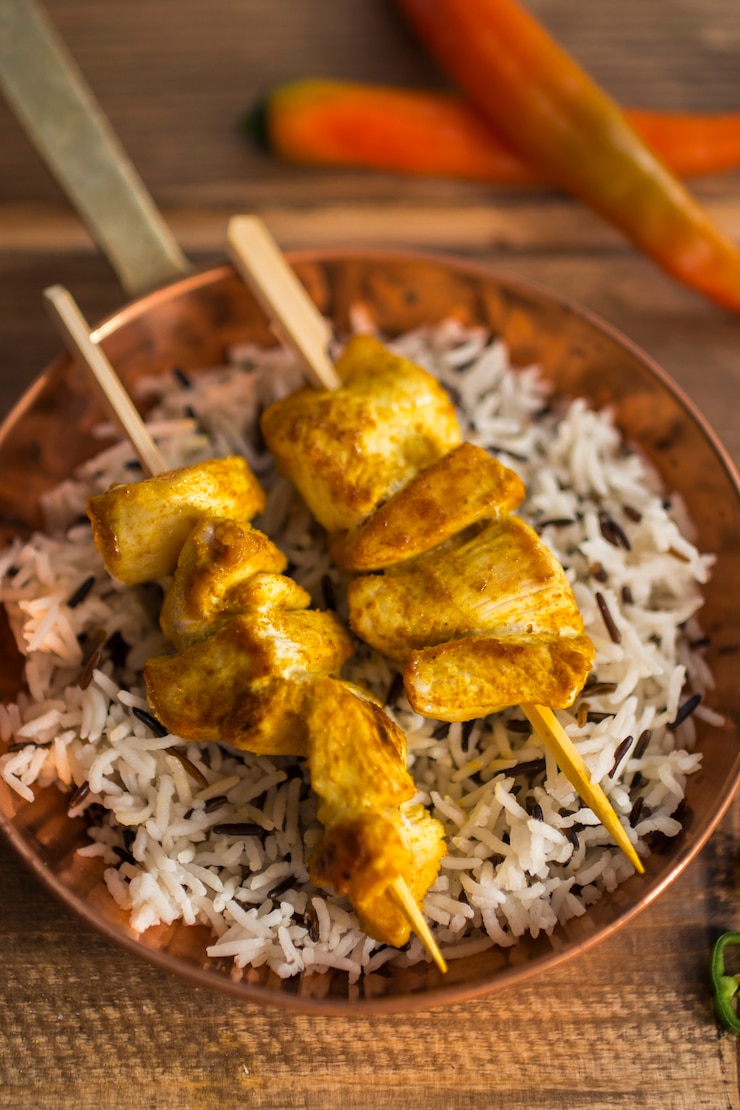 Free Photo chicken kebab and rice