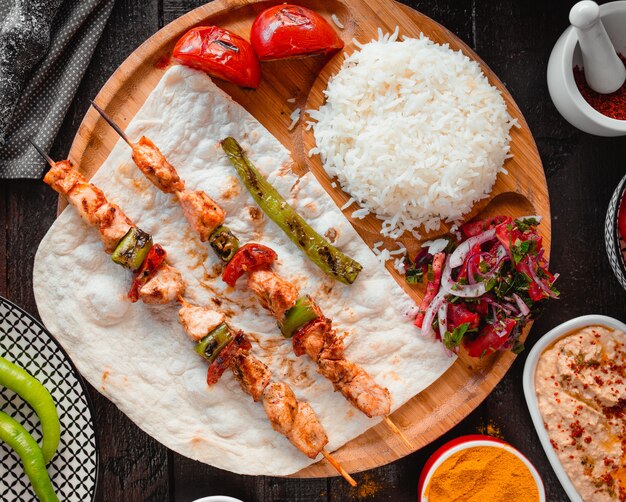 Chicken kebab with rice top view