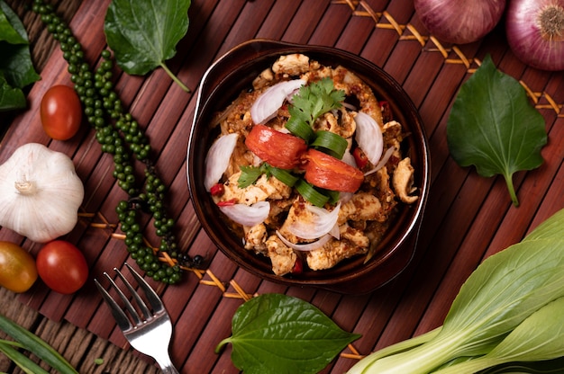 Chicken Larb on the plate With dried chilies, tomatoes, spring onions and lettuce