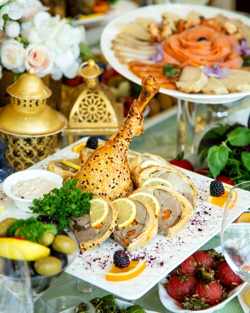 Chicken leg baked in dough served with meat pate with carrot