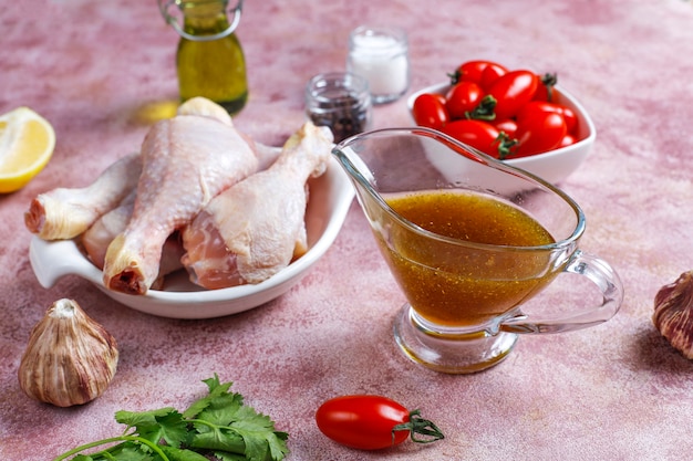 Chicken legs with spices and salt ready for cooking.