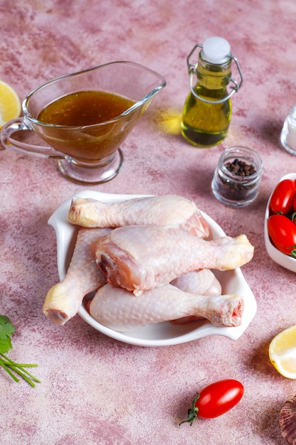 Chicken legs with spices and salt ready for cooking.