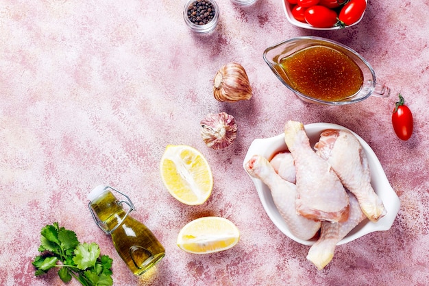 Chicken legs with spices and salt ready for cooking.