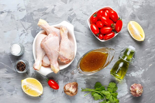 Chicken legs with spices and salt ready for cooking.