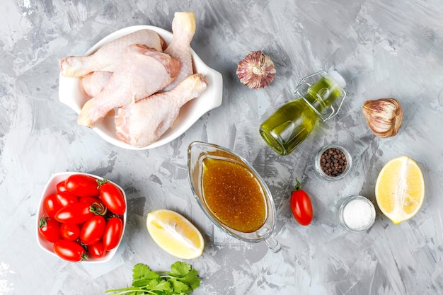 Chicken legs with spices and salt ready for cooking.