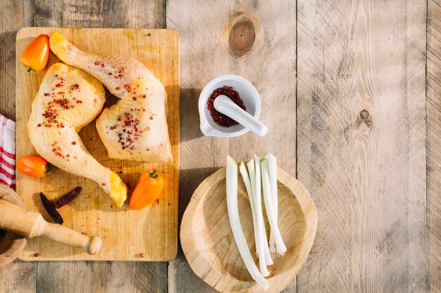 Chicken near vegetables and spices