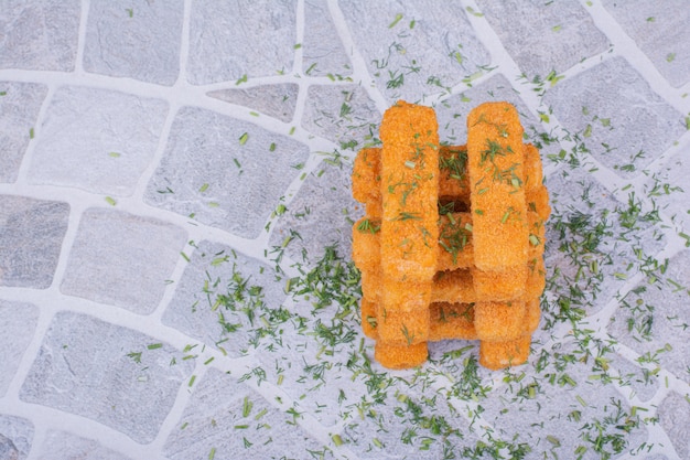 Free photo chicken nugget sticks with herbs and spices.