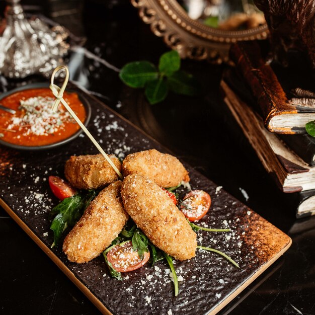 Chicken nuggets in batter sprinkled with grated parmesan