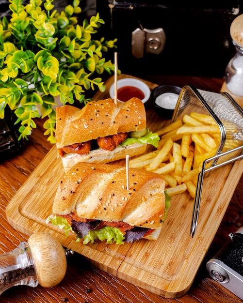 Chicken nuggets sandwich served with french fries