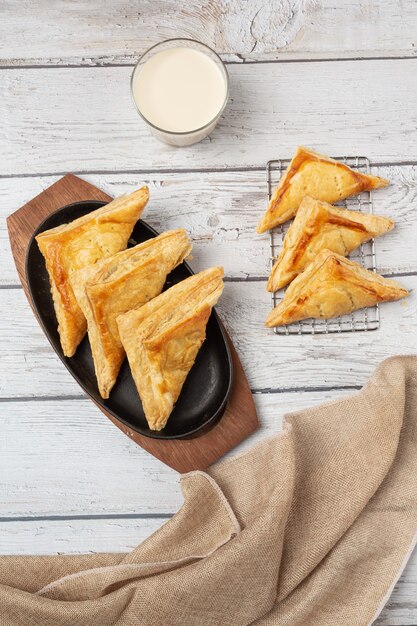 Chicken pie or kurnik that is beautifully decorated on the table.