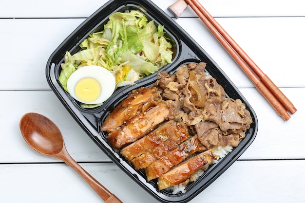 Free photo chicken rice bento