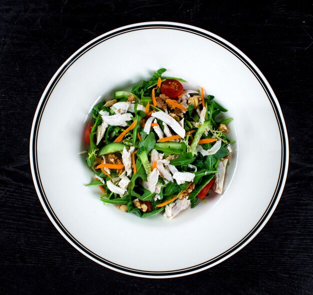 Chicken salad with arugula and nuts