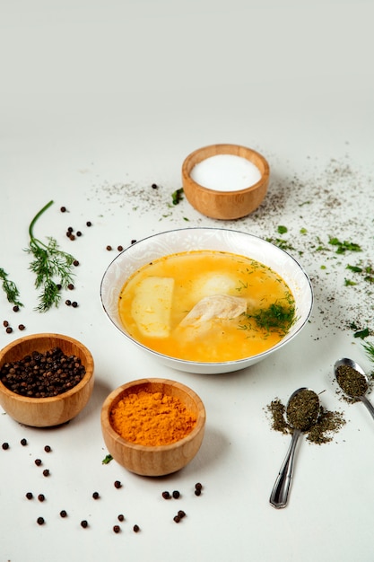 Chicken soup with rice on the table