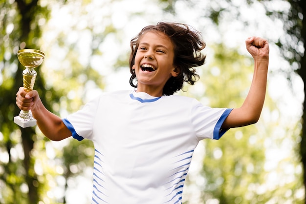 Child being victorious after a match of football