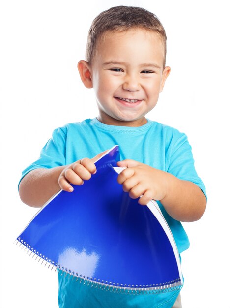 Child bending a notebook