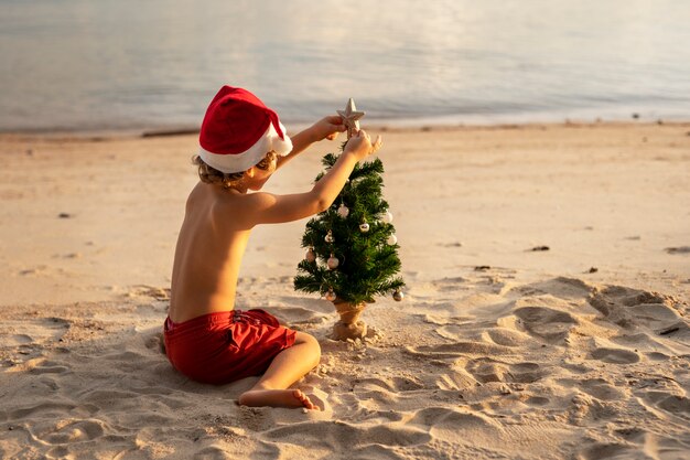 Child celebrating christmas in july