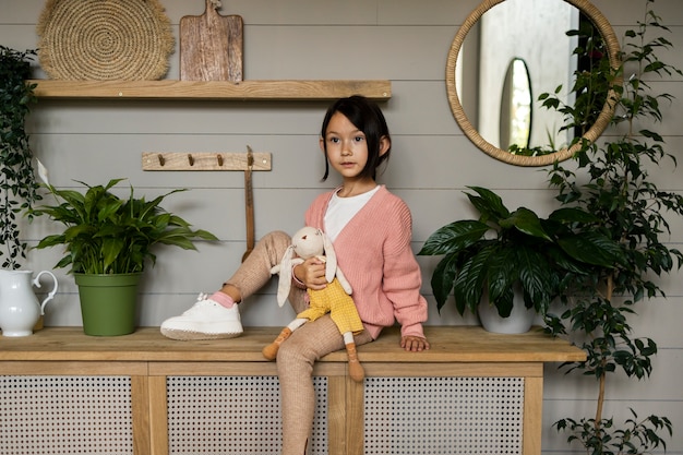 Child doing household activities indoors