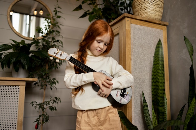 Free photo child doing household activities indoors