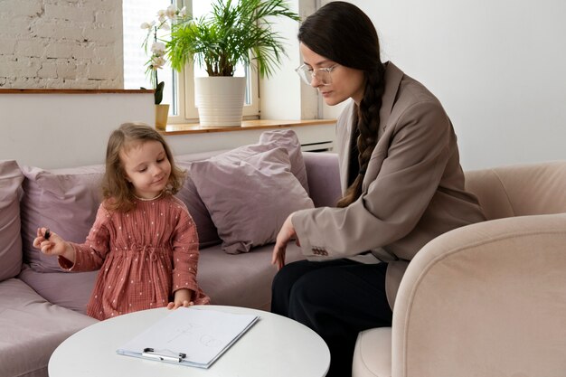 Child doing therapy session with psychologist