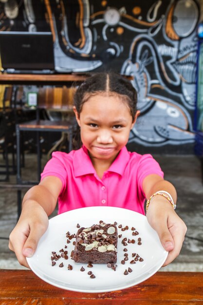 Child eat brownie