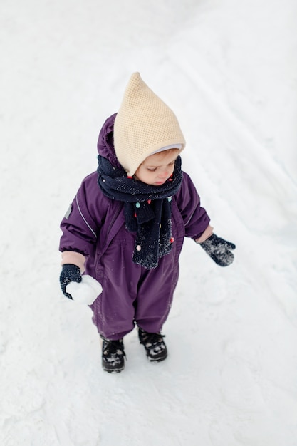 Free photo child enjoying winter activities in the snow