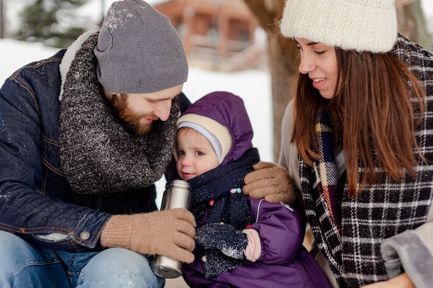 Free photo child enjoying winter activities with their family