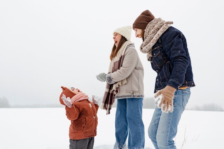 Free Photo child enjoying winter activities with their family
