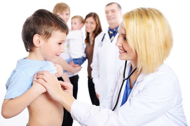 Child and female doctor with group happy people