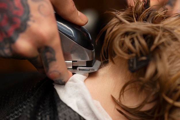 Free photo child getting a haircut at the salon